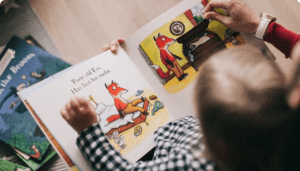 Young child reading a picture book