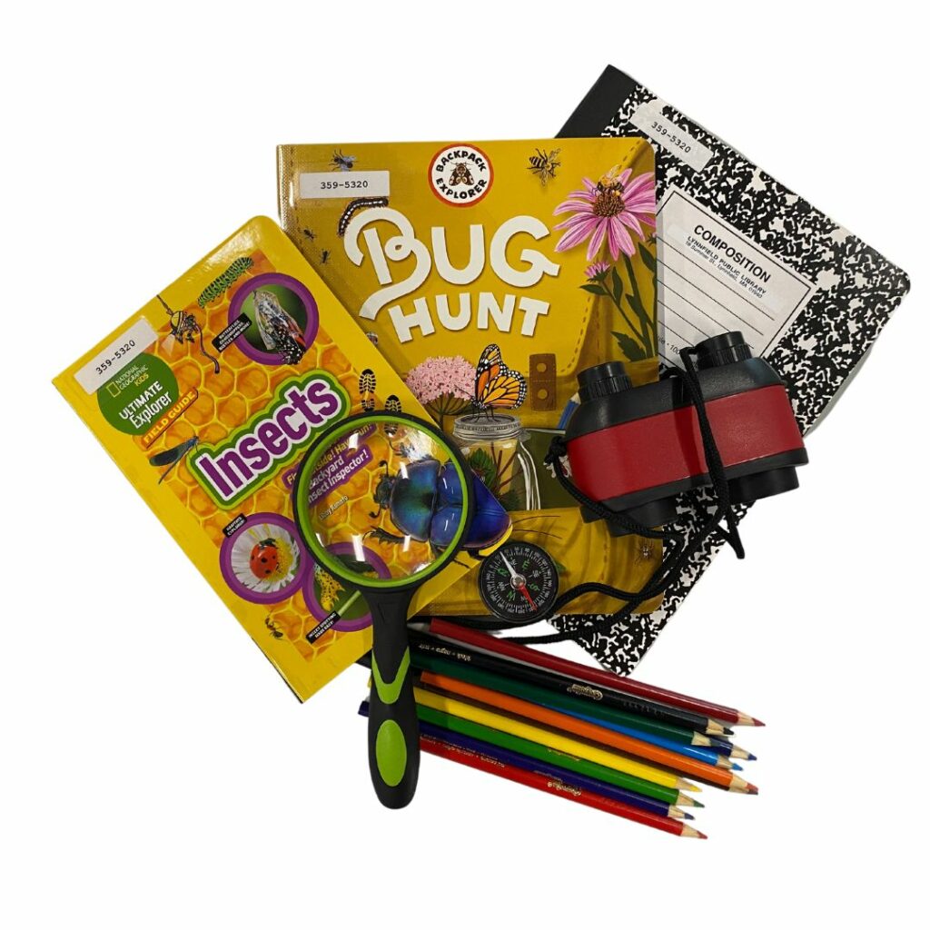 A collection of books and other materials including a magnifying glass and compass as part of an explorer kit to encourage kids to explore their world; this kit specifically focuses on bugs